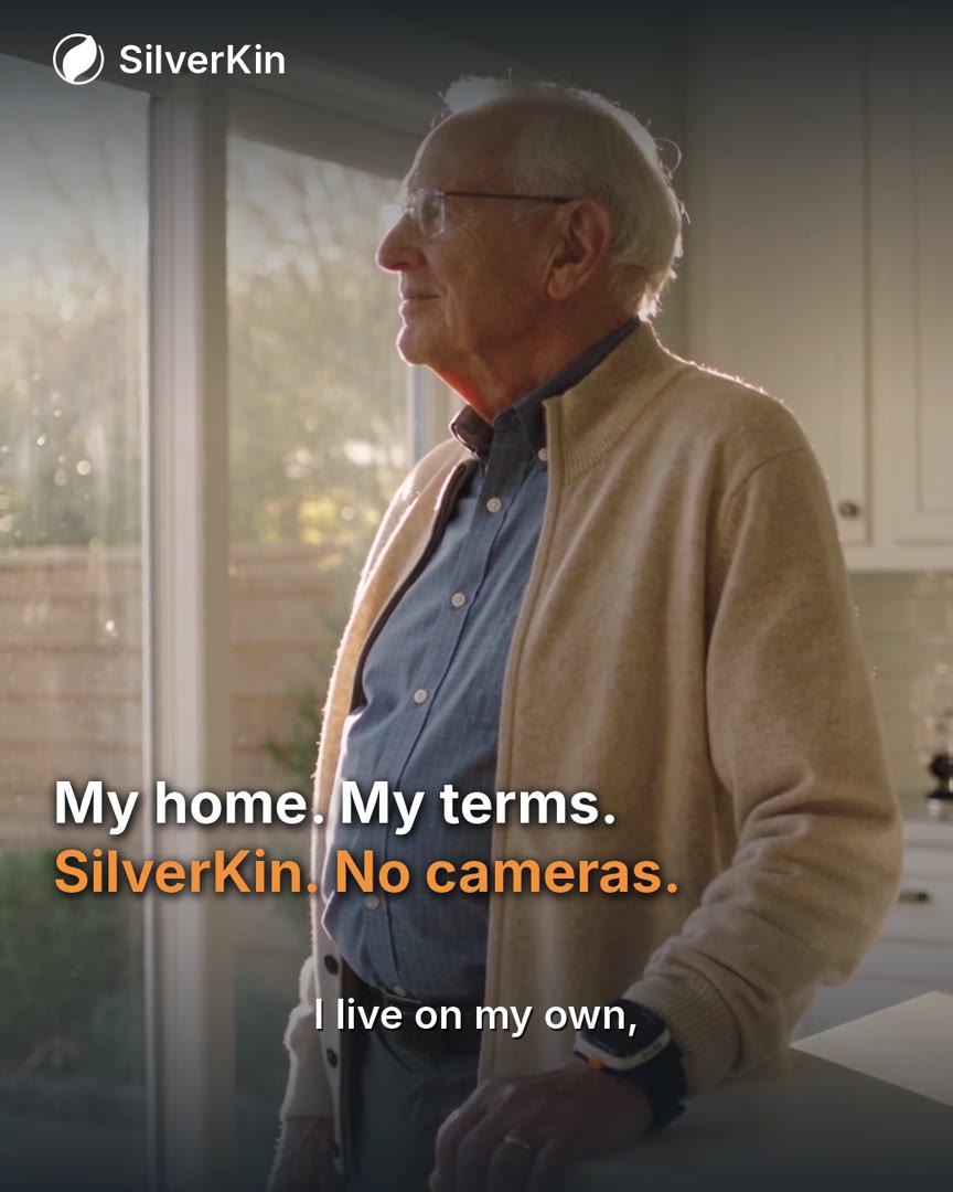 An older man at home by his kitchen window