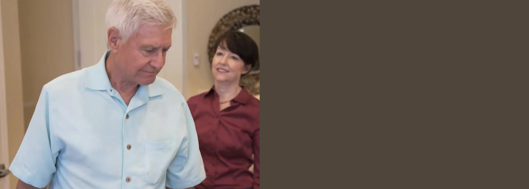 An older father at home with his adult daughter